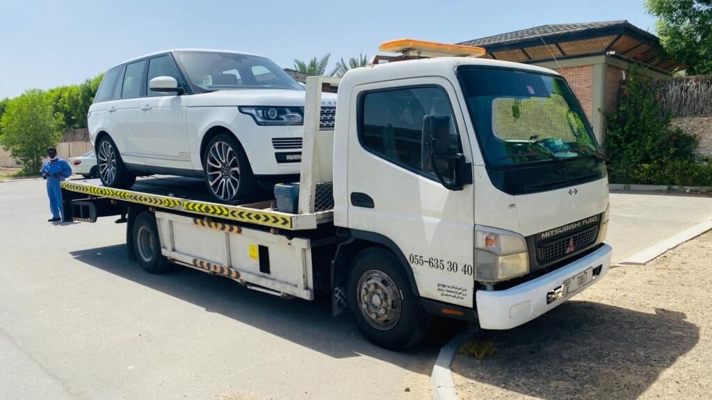 White Range Rover secured on a Sentinal Recovery flatbed truck